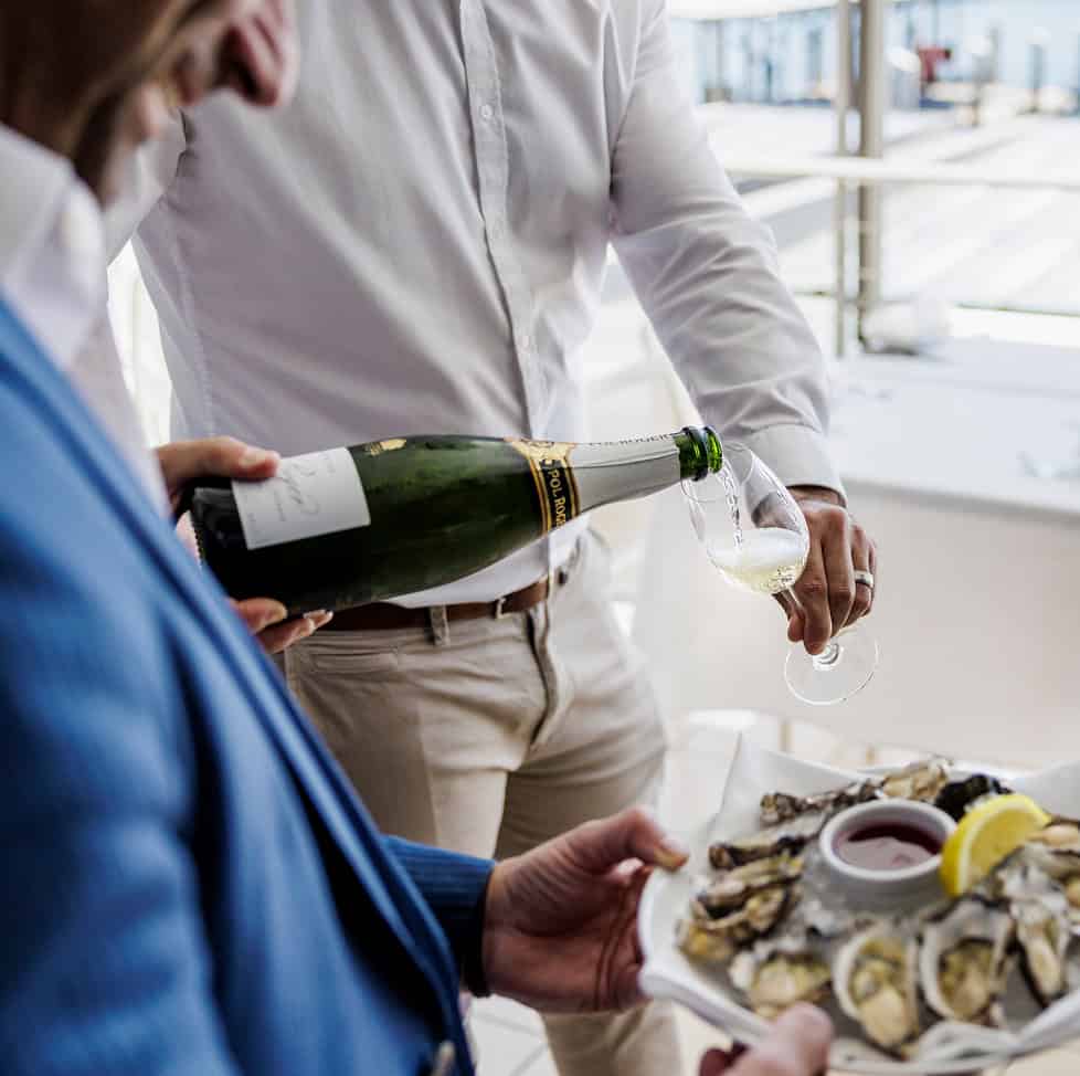 Steersons: Man pouring wine for customer